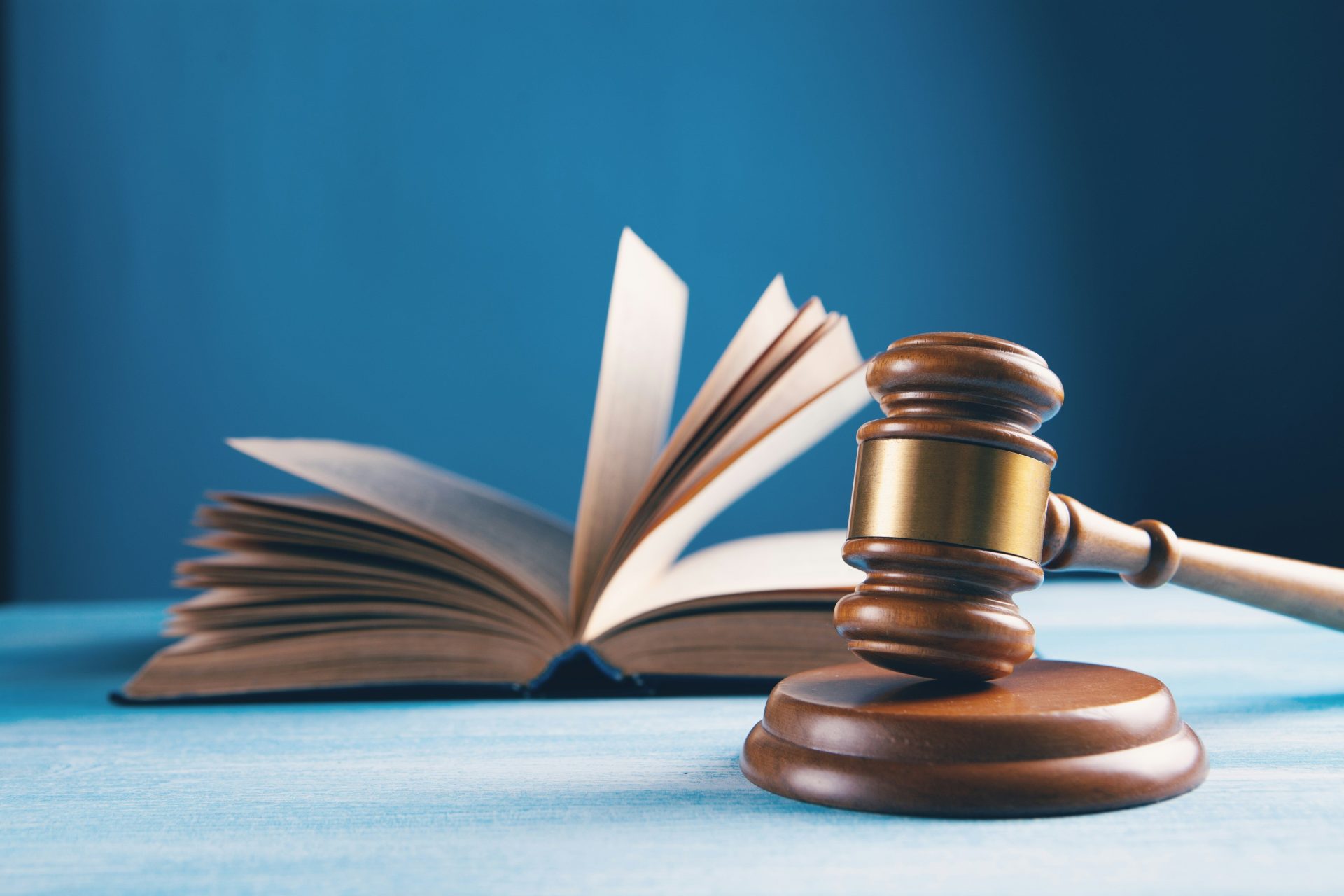 judges gavel and open book on table